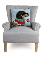 Holiday Dachshund Hooked Wool Christmas Throw Pillow on an armchair, showing the throw pillow at room scale, 18x18 inch