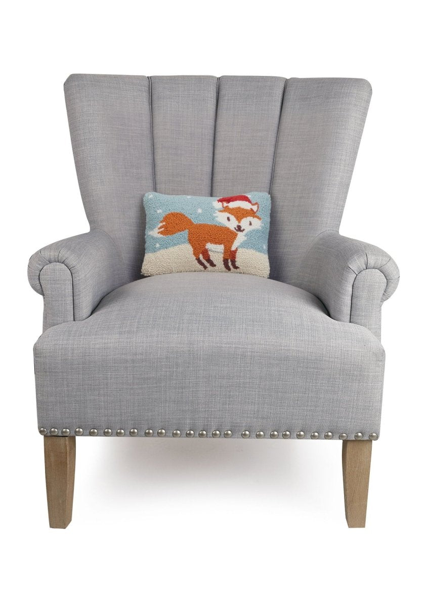 Holiday Fox Hooked Wool Christmas Throw Pillow on an armchair, showing the throw pillow at room scale, 8x12 inch
