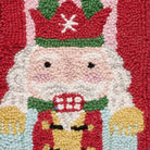 Closeup of Holiday Frames Nutcracker Hooked Wool Christmas Stocking showing stitch texture and craftsmanship detail