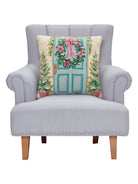 Holiday Front Porch Hooked Wool Christmas Throw Pillow on an armchair, showing the throw pillow at room scale, 20x20 inch
