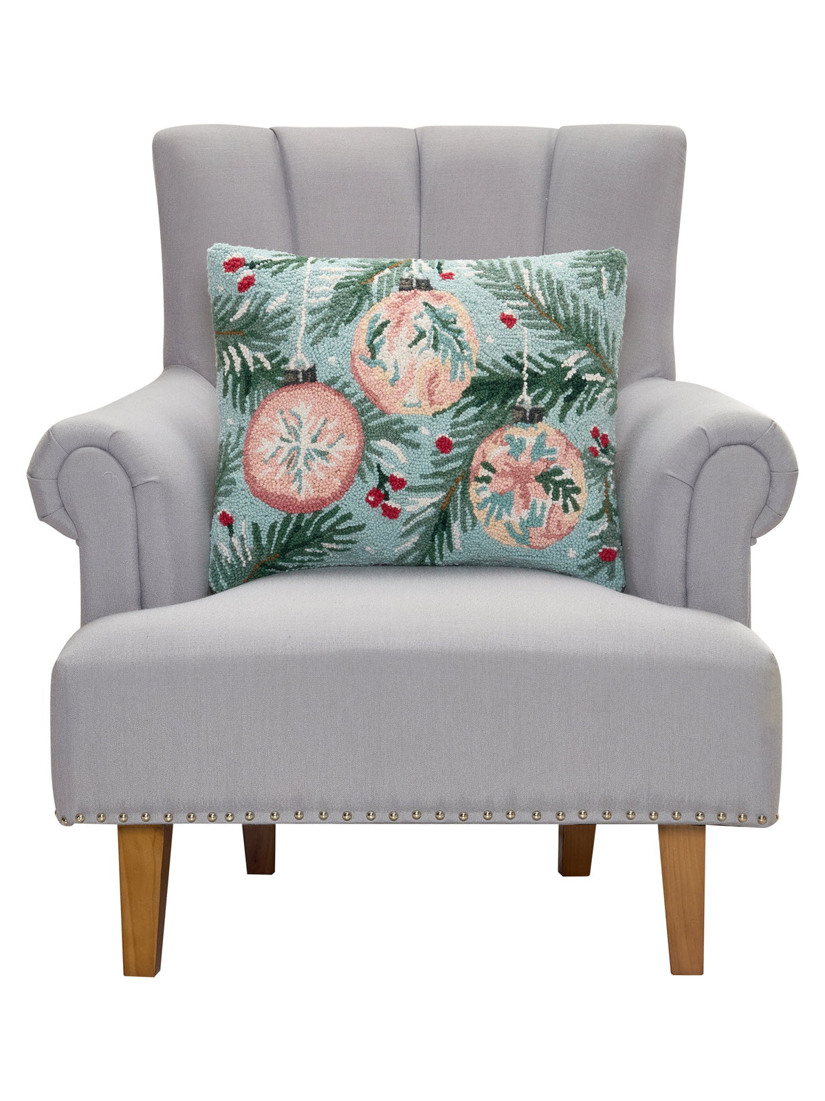 Holiday Hooked Wool Christmas Throw Pillow on an armchair, showing the throw pillow at room scale, 16x20 inch