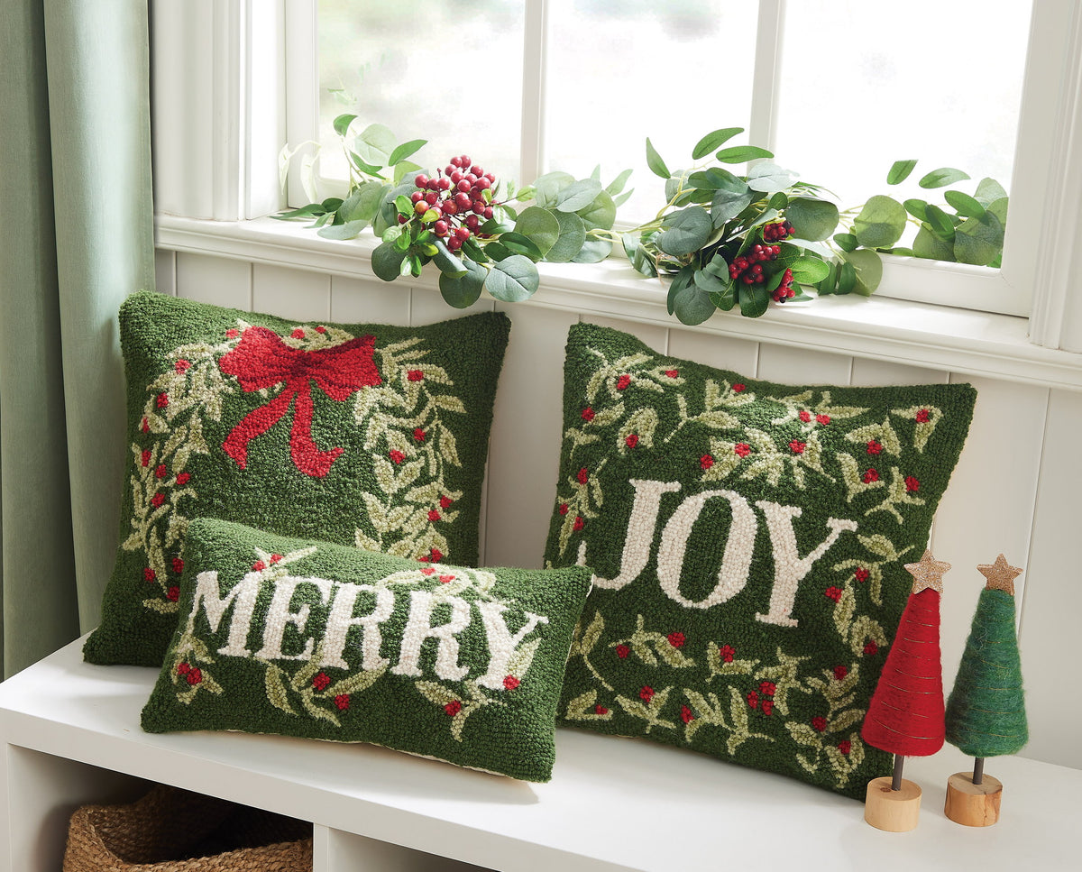 Holiday Joy Hooked Wool Christmas Throw Pillow shown alongside other designs in the same collection, 16x16 inch