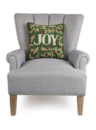 Holiday Joy Hooked Wool Christmas Throw Pillow on an armchair, showing the throw pillow at room scale, 16x16 inch