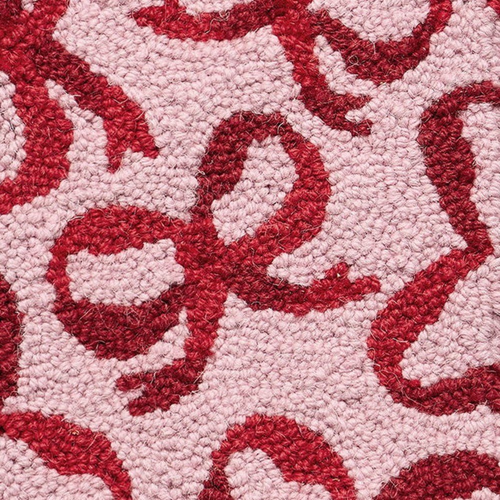 Closeup of Holiday Red Bow Hooked Wool Christmas Stocking showing stitch texture and craftsmanship detail
