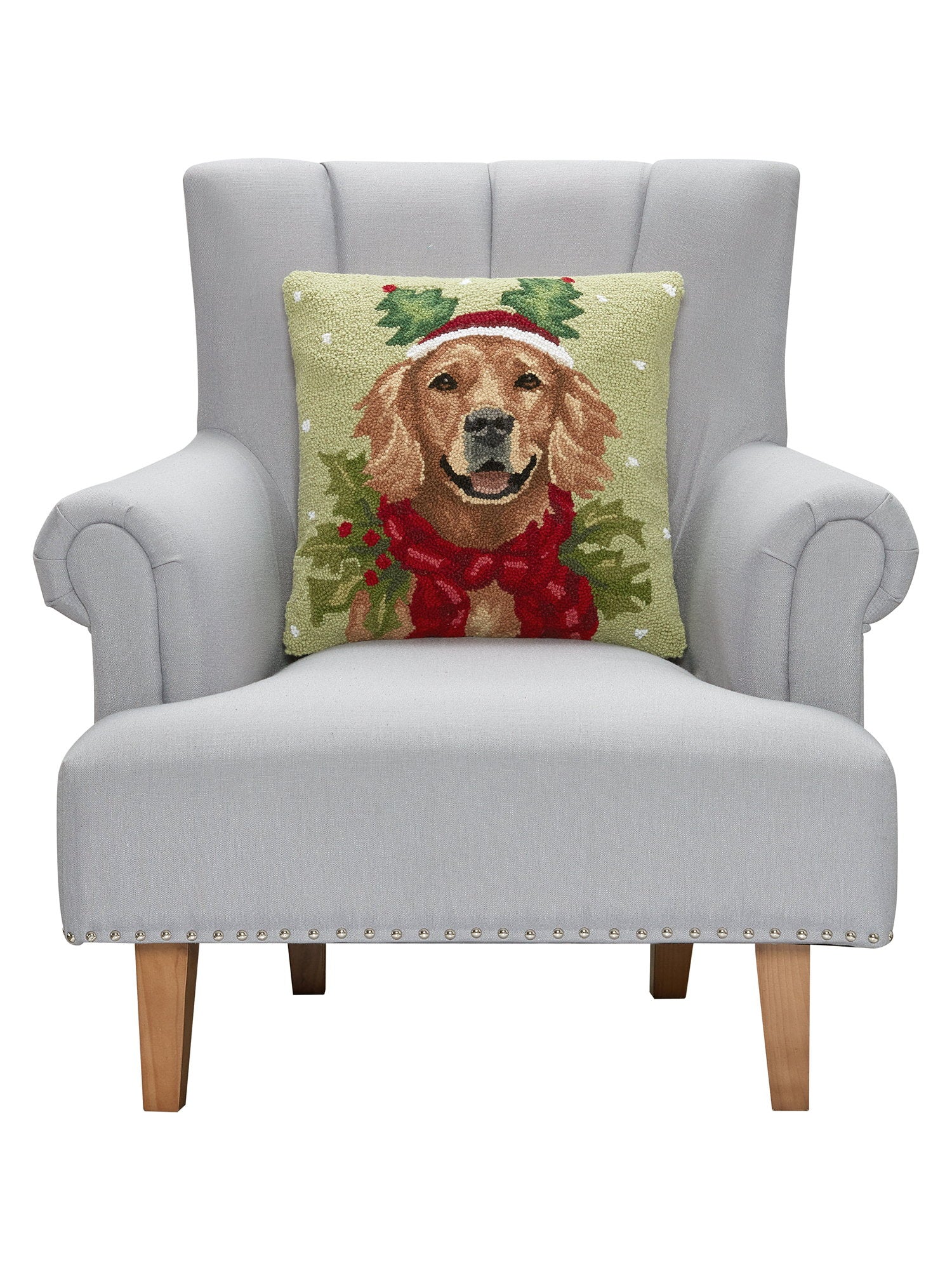Holiday Retriever Hooked Wool Christmas Throw Pillow on an armchair, showing the throw pillow at room scale, 18x18 inch