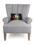 Holiday Snowman Hooked Wool Christmas Throw Pillow on an armchair, showing the throw pillow at room scale, 8x12 inch