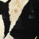 Holstein Cow Black Red pillow fabric closeup showing hand-embroidered needlepoint wool texture and color detail