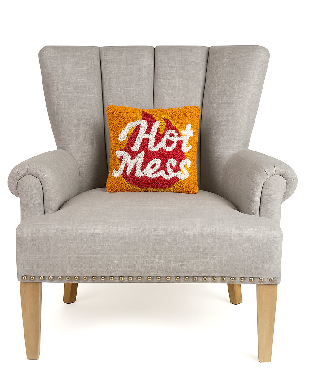 Hot Mess Hooked Wool Throw Pillow on an armchair, showing the throw pillow at room scale, 10x10 inch