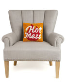 Hot Mess Hooked Wool Throw Pillow on an armchair, showing the throw pillow at room scale, 10x10 inch