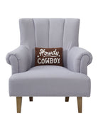 Howdy Cowboy Hooked Wool Throw Pillow on an armchair, showing the throw pillow at room scale, 8x12 inch