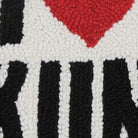 Closeup of I Love Skiing Hooked Wool Throw Pillow showing stitch texture and craftsmanship detail