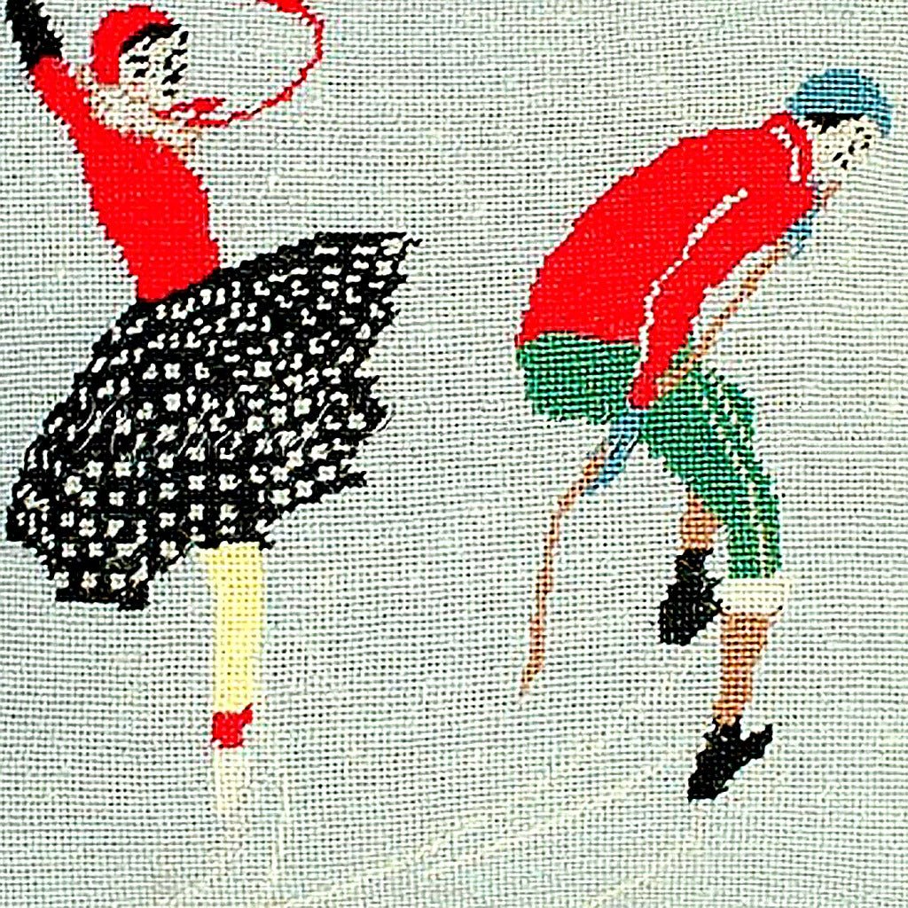 Closeup of Ice Skating Winter Joy needlepoint throw pillow highlighting hand-stitched wool craftsmanship and fabric detail