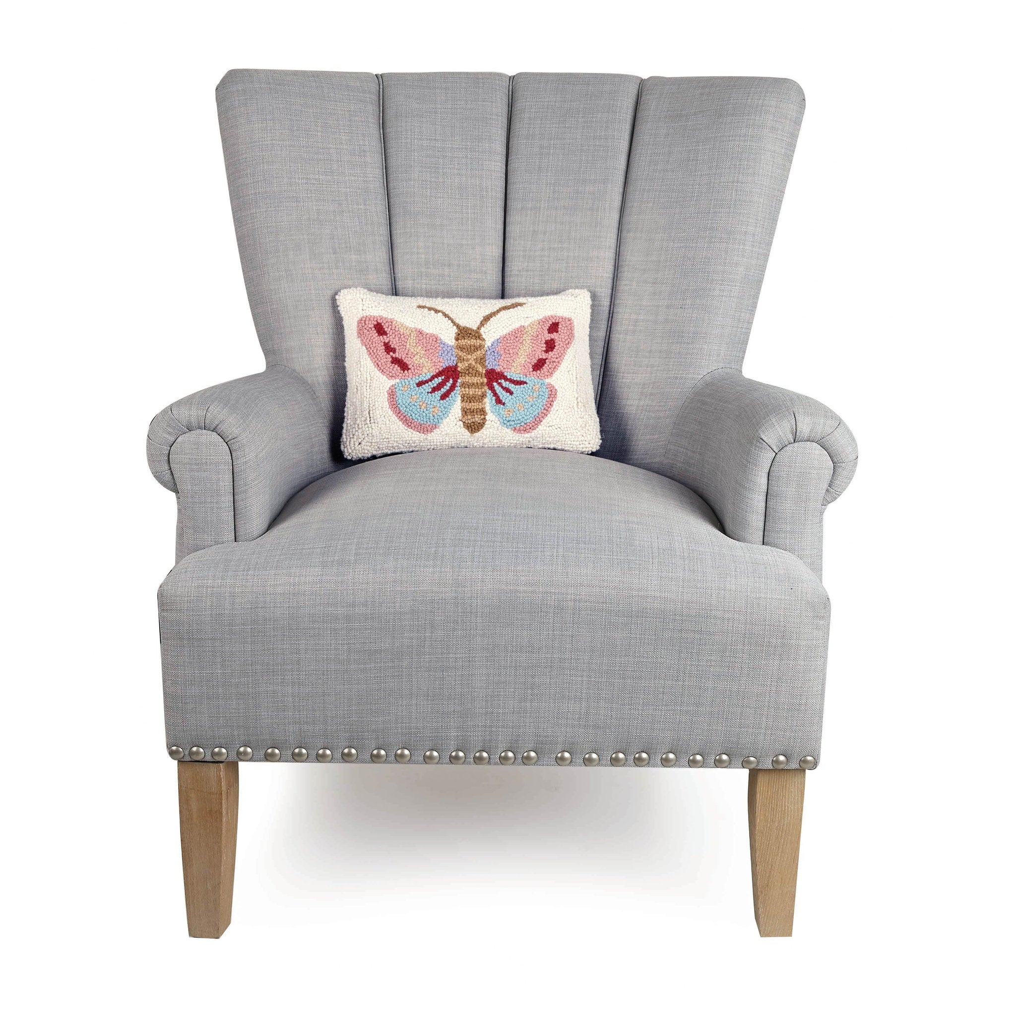 Insect Hooked Wool Throw Pillow on an armchair, showing the throw pillow at room scale, 8x12 inch