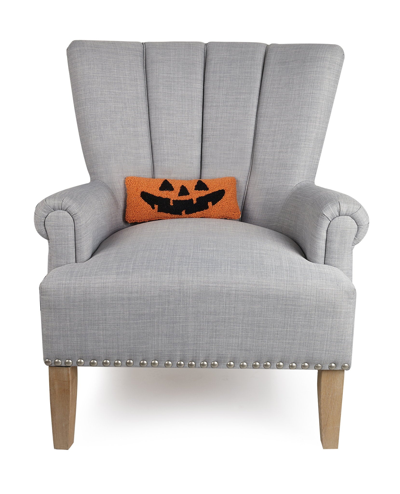 Jack-O-Lantern Hooked Wool Halloween Throw Pillow on an armchair, showing the throw pillow at room scale, 12x5 inch
