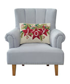 Joy Stars Hooked Wool Christmas Throw Pillow on an armchair, showing the throw pillow at room scale, 14x20 inch