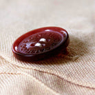 Kansas City, MO BBQ City Embroidered Travel Pillow - detail of decorative button closure
