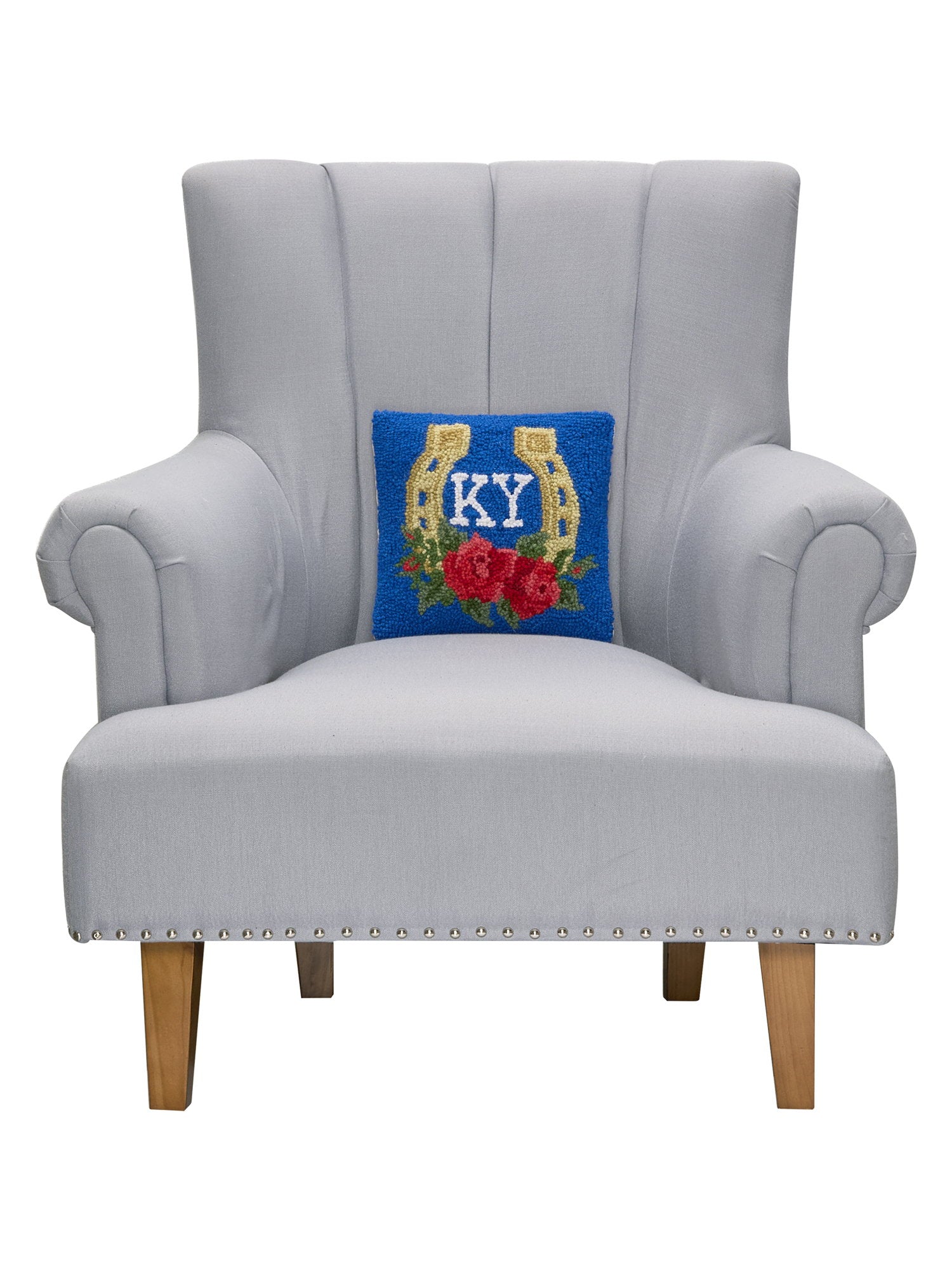 Kentucky Horseshoe & Rose Hooked Wool Throw Pillow on an armchair, showing the throw pillow at room scale, 10x10 inch