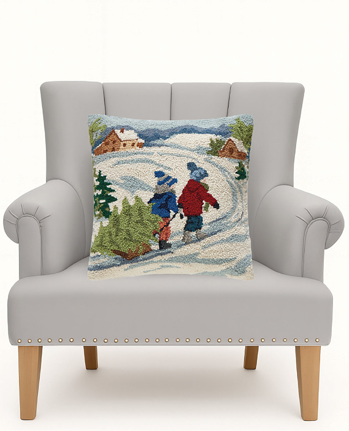 Kids Christmas Tree Hooked Wool Throw Pillow on an armchair, showing the throw pillow at room scale, 18x18 inch