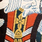 Hand-stitched wool detail of King of Spades Playing Card needlepoint pillow showing intricate weave pattern and texture