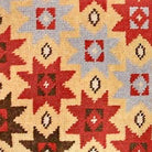 Closeup of Konya Aztec Artistry Beige needlepoint throw pillow highlighting hand-stitched wool craftsmanship and fabric detail