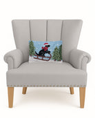 Lab on Sled Hooked Wool Christmas Throw Pillow on an armchair, showing the throw pillow at room scale, 8x12 inch