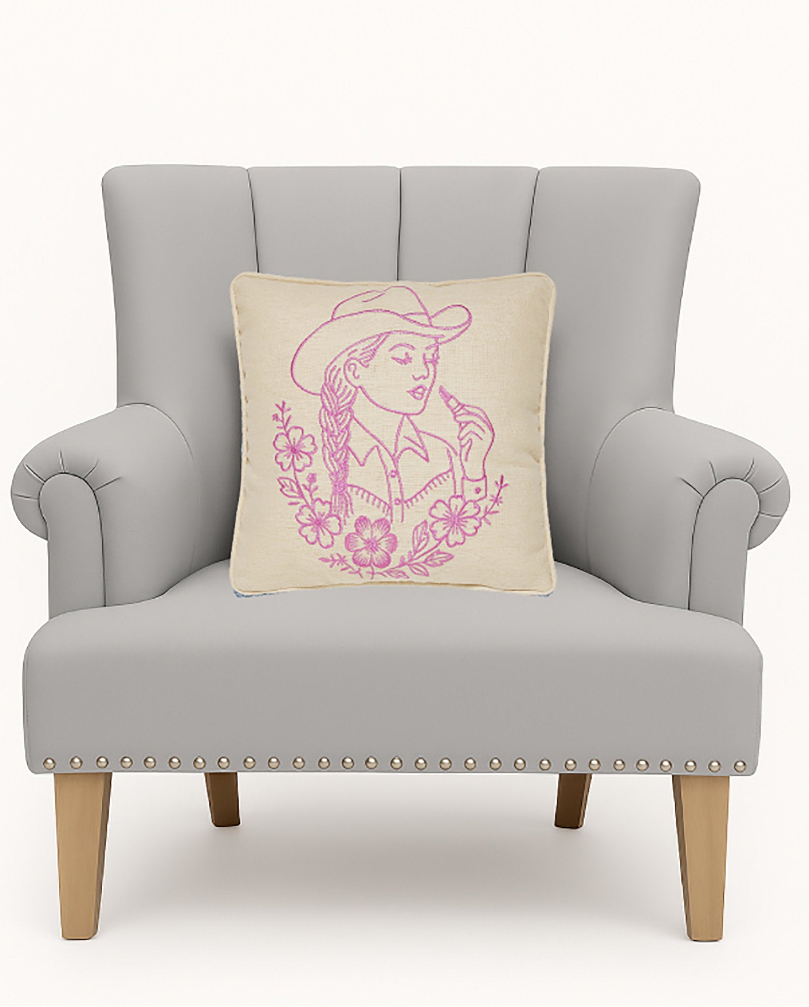 Lady Embroidered Throw Pillow on an armchair, showing the throw pillow at room scale, 14x14 inch