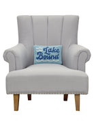 Lake Bound Hooked Wool Throw Pillow on an armchair, showing the throw pillow at room scale, 8x12 inch