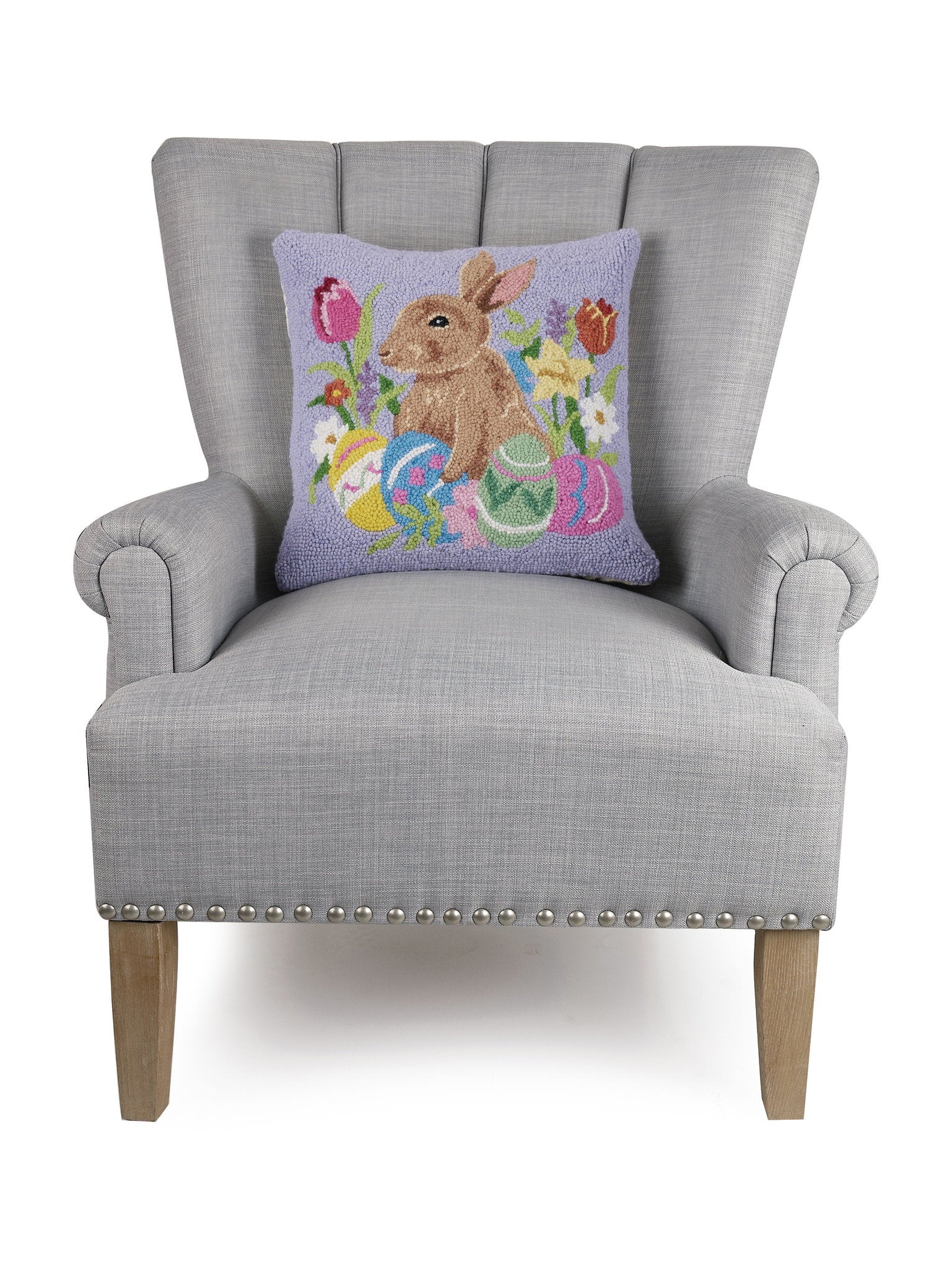 Lavender Bunny with Eggs Hooked Wool Easter Throw Pillow on an armchair, showing the throw pillow at room scale, 16x16 inch