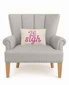 Le Sigh Hooked Wool Throw Pillow on an armchair, showing the throw pillow at room scale, 8x12 inch