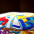 Long Island XL Embroidered Travel Throw Pillow - close-up detail of hand-embroidered needlepoint stitching
