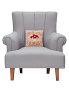 Love You So Much Hooked Wool Throw Pillow on an armchair, showing the throw pillow at room scale, 10x10 inch