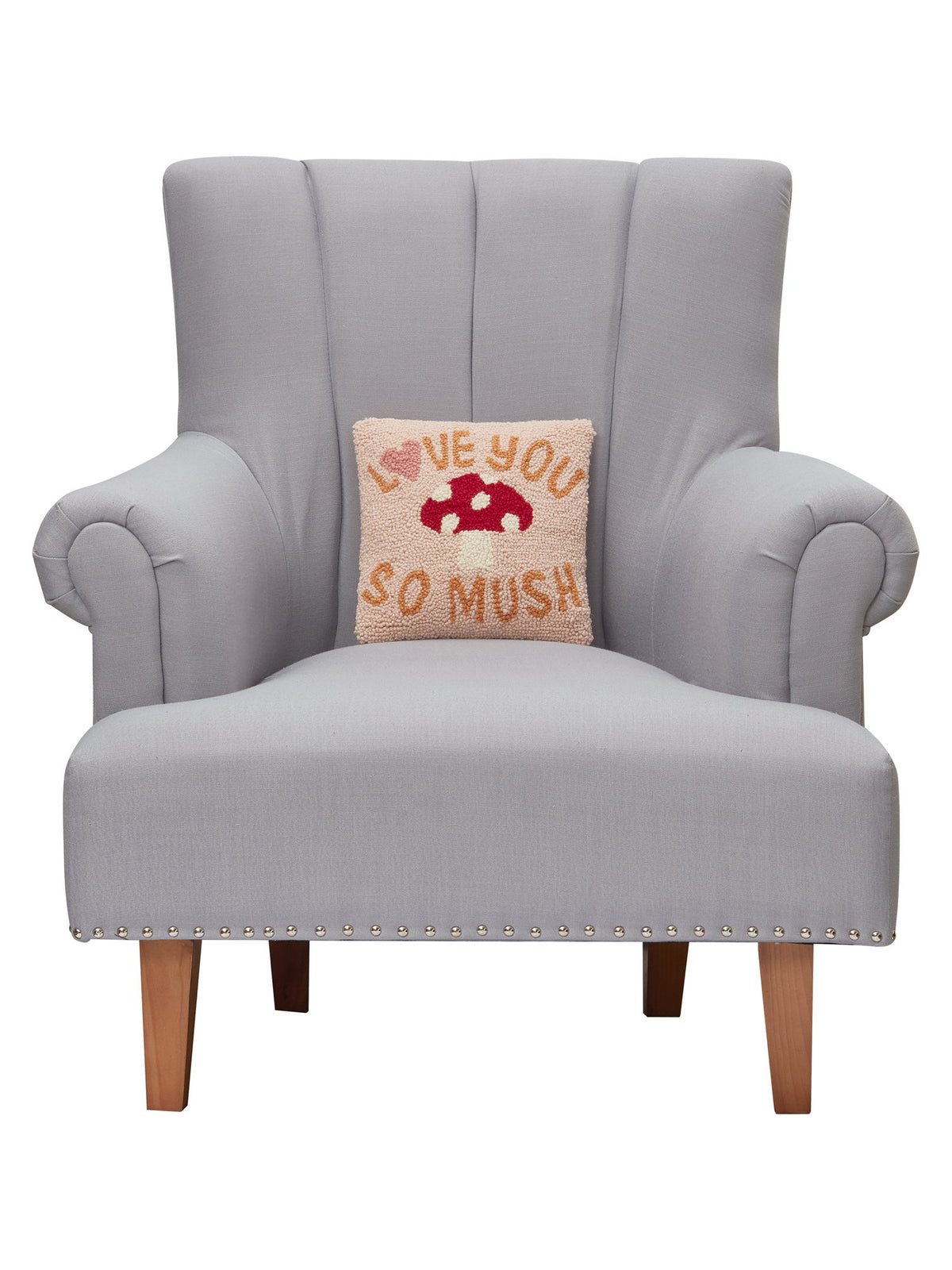 Love You So Much Hooked Wool Throw Pillow on an armchair, showing the throw pillow at room scale, 10x10 inch