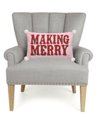 Making Merry with Pom Poms Hooked Wool Christmas Throw Pillow on an armchair, showing the throw pillow at room scale, 9x16 inch