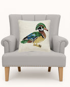 Mallard Hooked Wool Throw Pillow on an armchair, showing the throw pillow at room scale, 16x16 inch