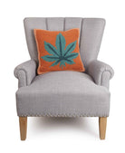 Mary Jane Hooked Wool Throw Pillow on an armchair, showing the throw pillow at room scale, 16x16 inch
