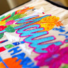 Maui Island Paradise Embroidered Travel Throw Pillow - close-up detail of hand-embroidered needlepoint stitching