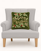 Merry Christmas Embroidered Throw Pillow on an armchair, showing the throw pillow at room scale, 16x16 inch