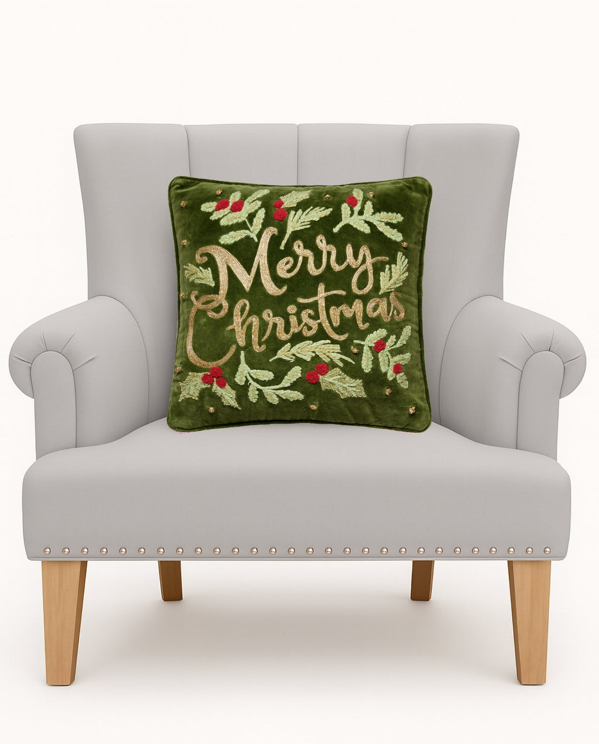 Merry Christmas Embroidered Throw Pillow on an armchair, showing the throw pillow at room scale, 16x16 inch