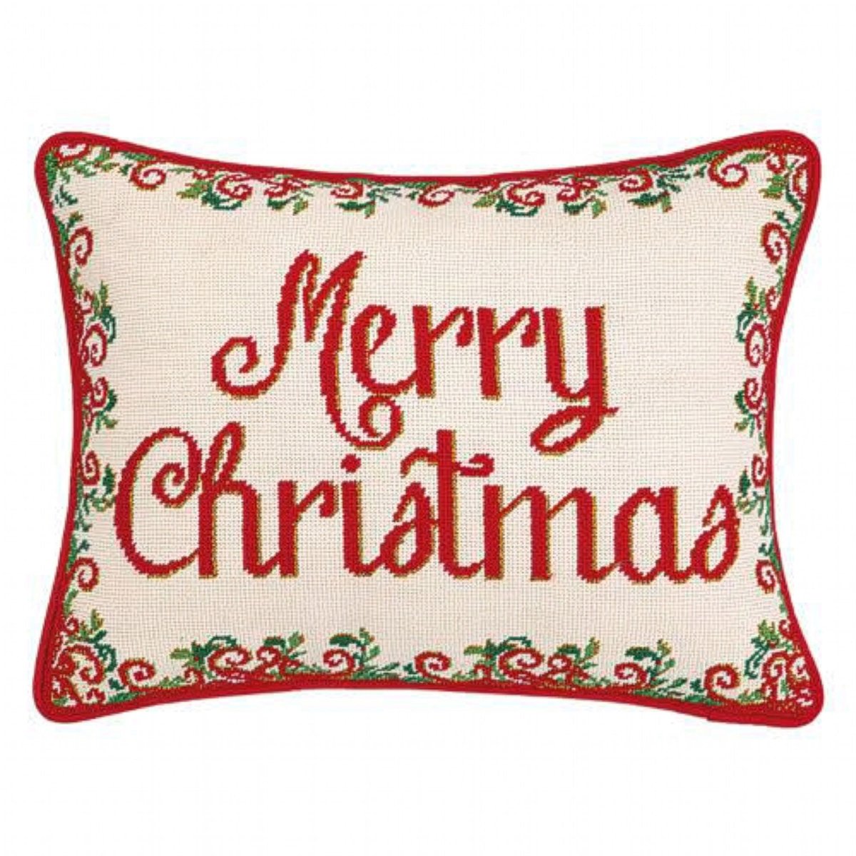 A rectangular needlepoint pillow with 'Merry Christmas' stitched in red cursive text on an off-white canvas background, framed by a red border with green and red holiday vine patterns.