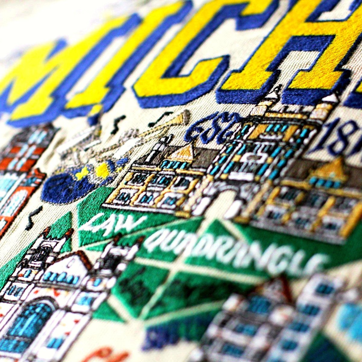 Michigan Wolverines Embroidered College Pillow - close-up detail of hand-embroidered needlepoint stitching