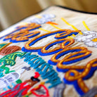 Mississippi Coast Beach Embroidered Throw Pillow - close-up detail of hand-embroidered needlepoint stitching