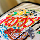 Mississippi State Delta Travel Embroidered Throw Pillow - close-up detail of hand-embroidered needlepoint stitching
