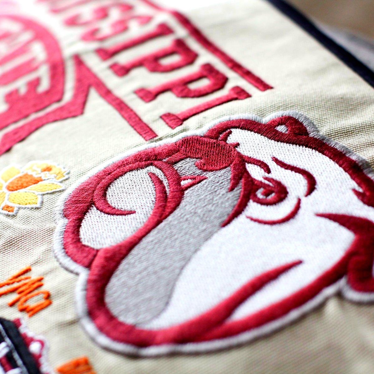 Mississippi State University Bulldogs Embroidered Pillow - close-up detail of hand-embroidered needlepoint stitching