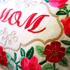 Mom Tan Love Gift Embroidered Throw Pillow - close-up detail of hand-embroidered needlepoint stitching