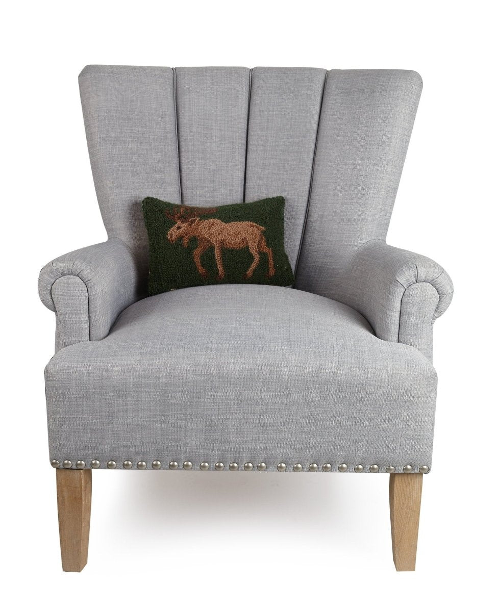 Moose Hooked Wool Throw Pillow on an armchair, showing the throw pillow at room scale, 8x12 inch