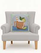 Moscow Mule Hooked Wool Throw Pillow on an armchair, showing the throw pillow at room scale, 16x16 inch
