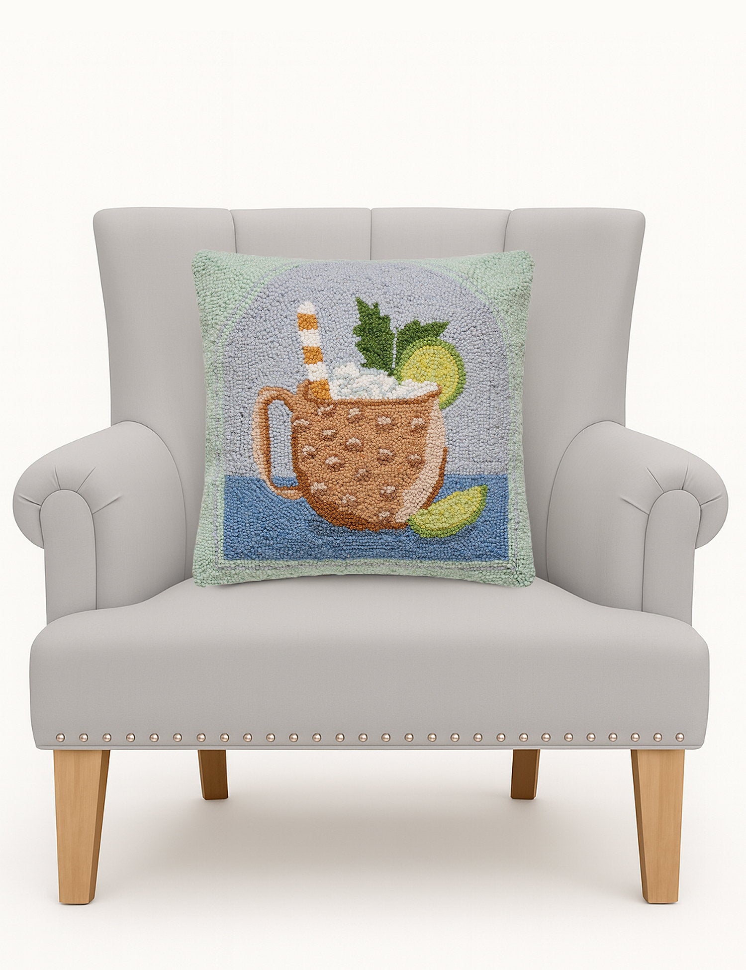 Moscow Mule Hooked Wool Throw Pillow on an armchair, showing the throw pillow at room scale, 16x16 inch