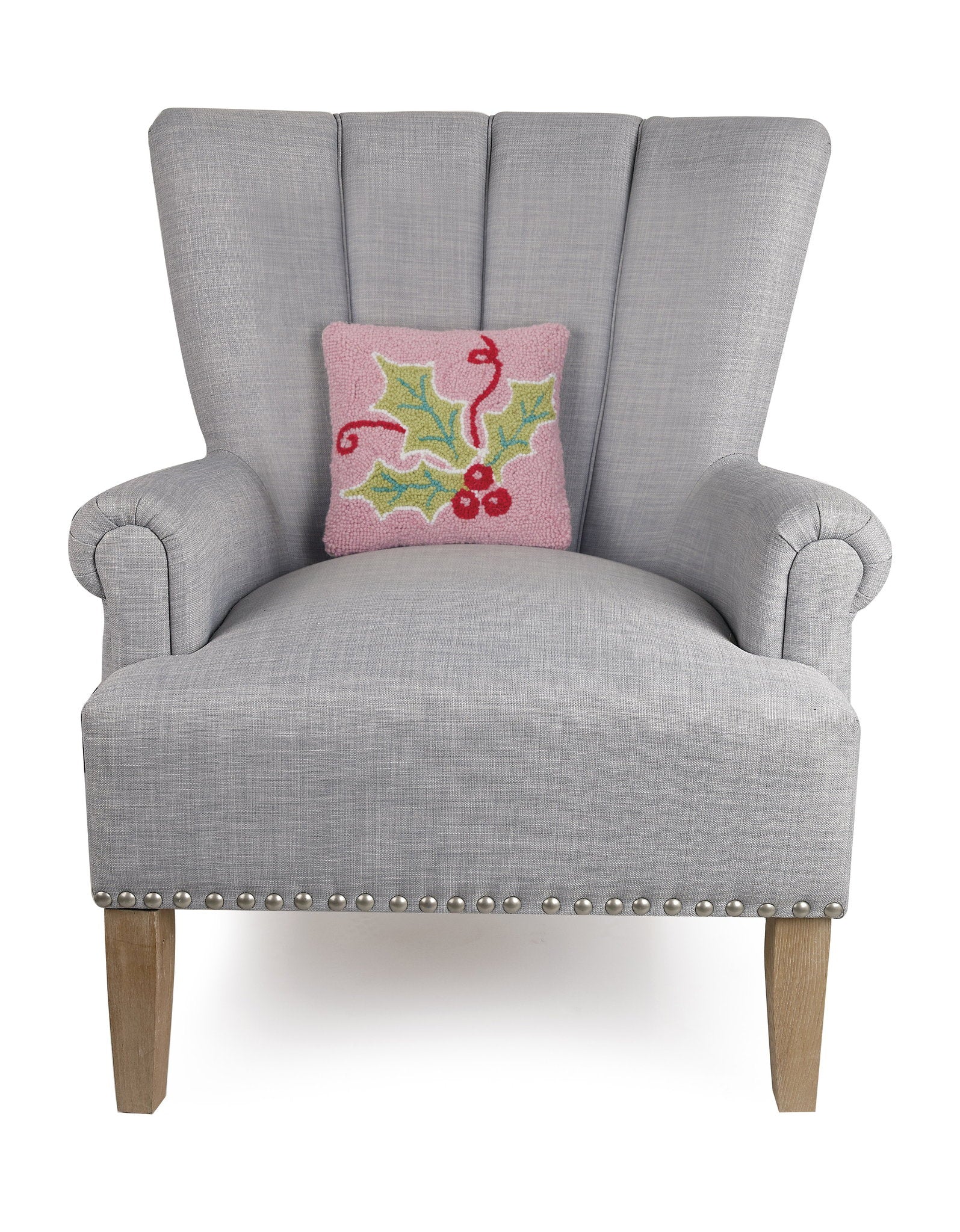 Multi Color Holly Hooked Wool Christmas Throw Pillow on an armchair, showing the throw pillow at room scale, 10x10 inch