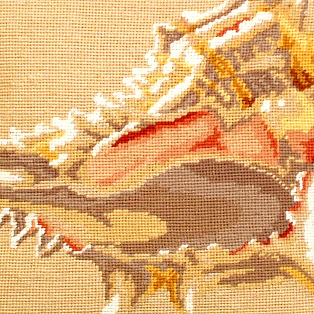 Hand-stitched wool detail of Murex Conch Shell Coastal needlepoint pillow showing intricate weave pattern and texture