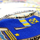 Navy Military Appreciation Embroidered Throw Pillow - close-up detail of hand-embroidered needlepoint stitching